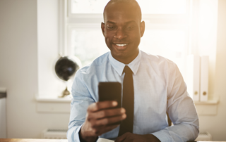 business-man-checking-cell-phone-messages