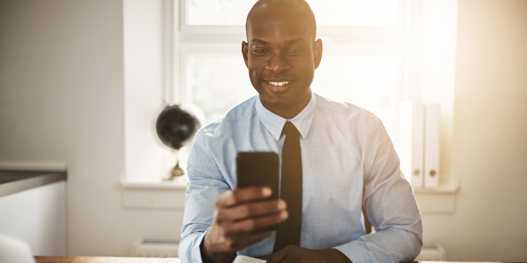 business-man-checking-cell-phone-messages