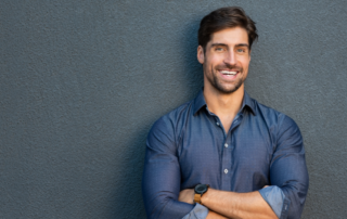 business-man-smiling-and-posing-while-crossing-his-arms