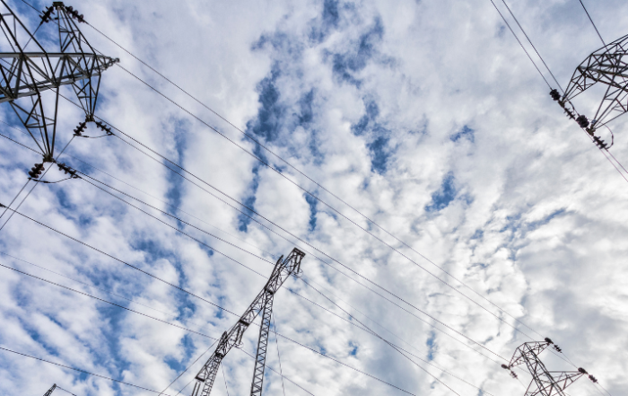 electrical-power-lines-against-cloud-filled-sky