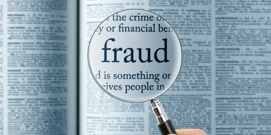 magnifying-glass-over-the-word-fraud