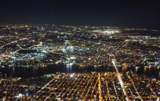 aerial-view-of-city-lights-at-night-depicting-the-electric-grid