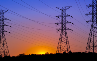 electric-transmission-lines-with-sunset-in-background