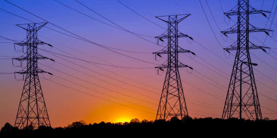 electric-transmission-lines-with-sunset-in-background