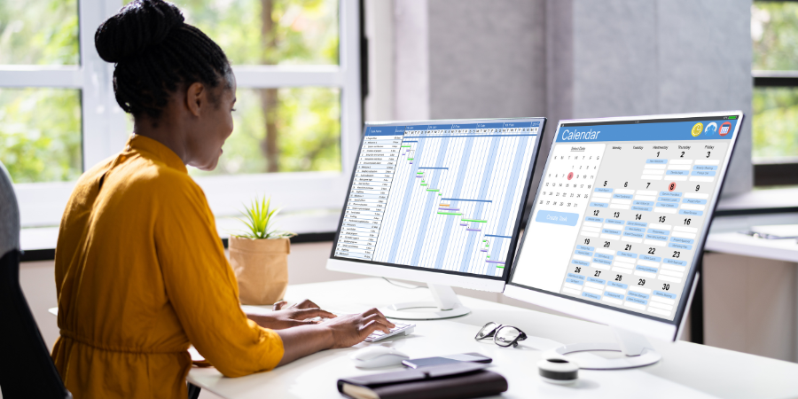 woman-looking-at-calendar-and-schedule-on-computer-screens