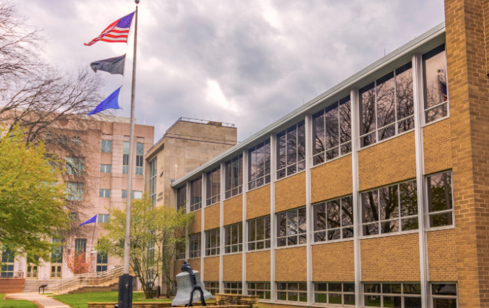 government-building-with-american-flag-outside-on-flag-pole